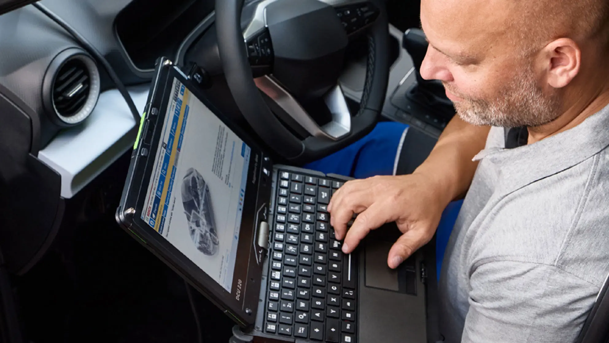 Technician Using Bosch ESI Software During Diagnostics